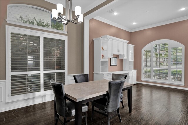 dining room featuring ornamental molding, an inviting chandelier, and dark wood-type flooring