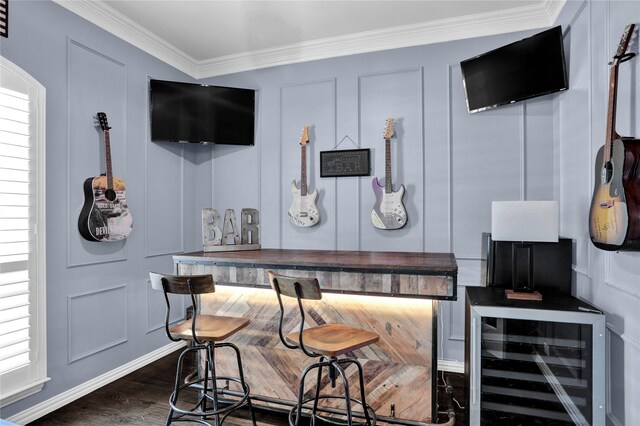 bar with wine cooler, ornamental molding, and dark hardwood / wood-style flooring