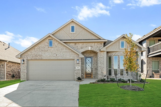 view of front facade featuring a front yard and a garage