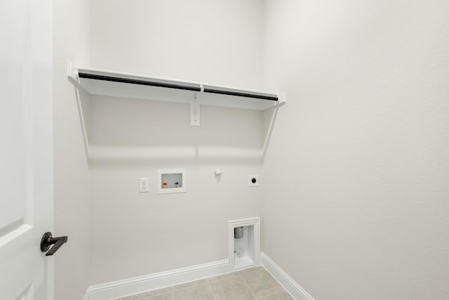 washroom featuring hookup for an electric dryer, hookup for a gas dryer, light tile patterned floors, and hookup for a washing machine