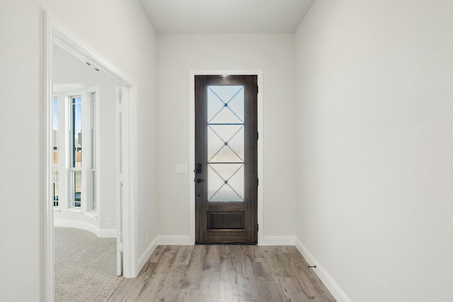 foyer with light hardwood / wood-style flooring