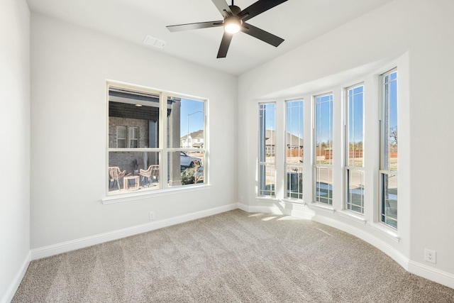 empty room with carpet and ceiling fan