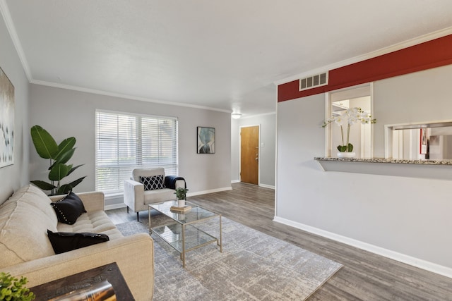 living room featuring ornamental molding and hardwood / wood-style flooring