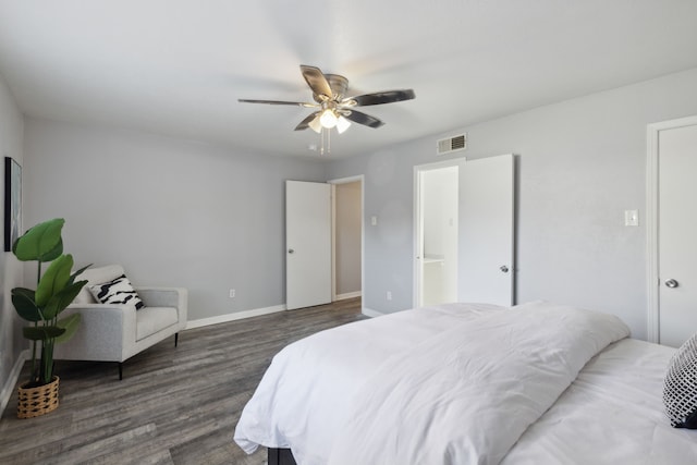 bedroom with ceiling fan and dark hardwood / wood-style flooring