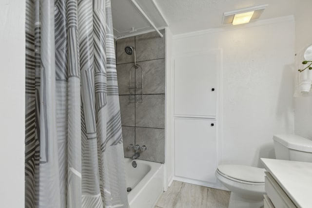 full bathroom featuring toilet, vanity, ornamental molding, and shower / tub combo with curtain