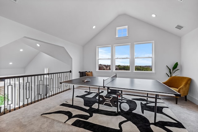 rec room featuring vaulted ceiling and carpet