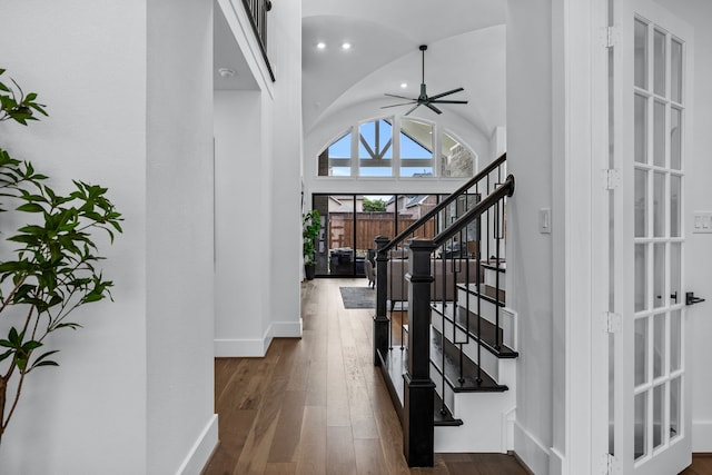 interior space with dark wood-type flooring, high vaulted ceiling, and ceiling fan