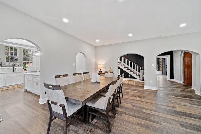 dining room with dark hardwood / wood-style flooring and sink