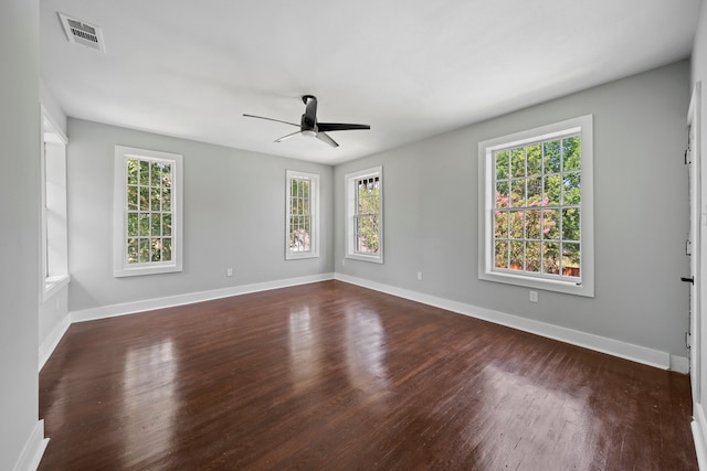 unfurnished room featuring ceiling fan and dark hardwood / wood-style flooring