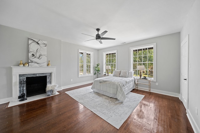 bedroom featuring dark hardwood / wood-style floors and ceiling fan