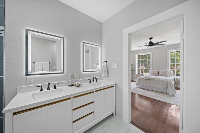 bathroom with ceiling fan and vanity