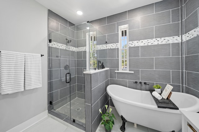 bathroom featuring tile walls, tile patterned floors, and shower with separate bathtub