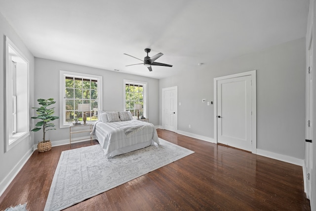 bedroom featuring dark wood-type flooring and ceiling fan