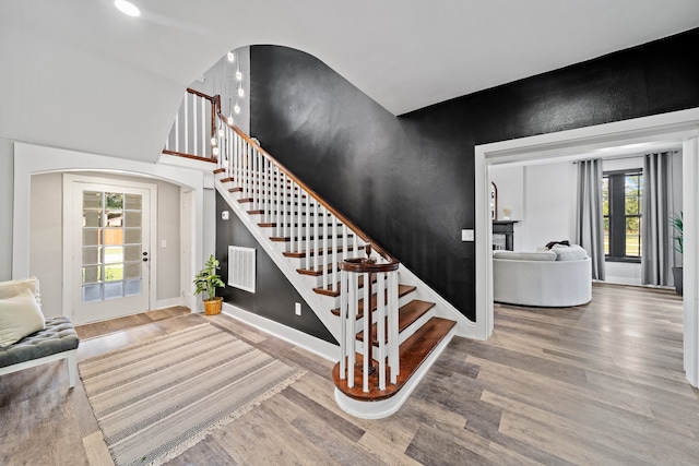 staircase featuring hardwood / wood-style flooring