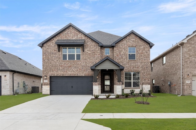 view of front of house featuring a garage, central AC unit, and a front lawn