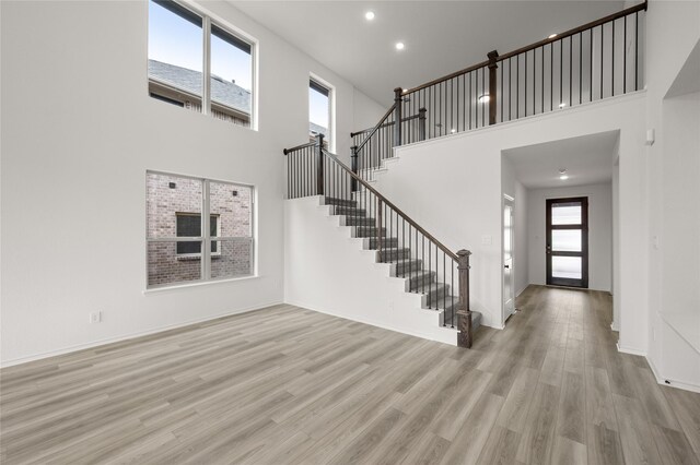 living room with high vaulted ceiling, wood-type flooring, and ceiling fan