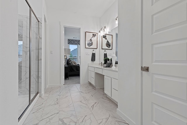 bathroom with walk in shower and vanity