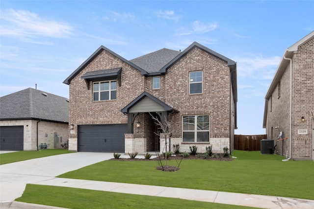 view of front of house featuring a garage, central AC unit, and a front yard