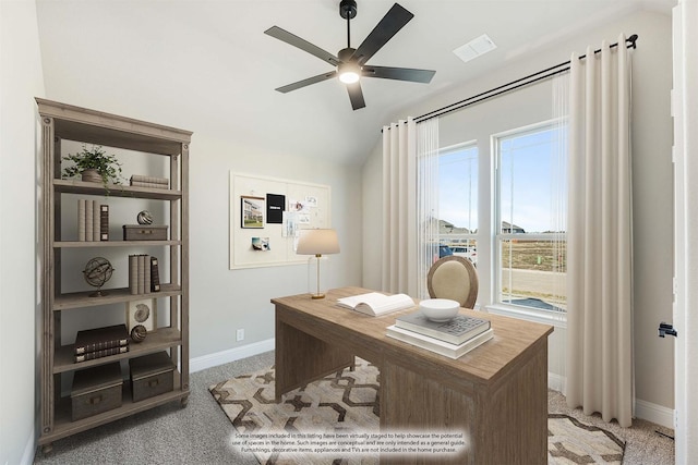 carpeted home office with ceiling fan and lofted ceiling