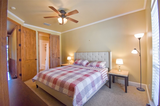 bedroom featuring ceiling fan, carpet, and crown molding