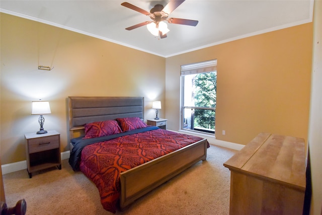 carpeted bedroom featuring ceiling fan and ornamental molding