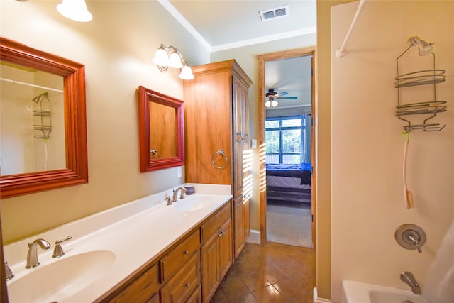 bathroom with tile patterned flooring, tub / shower combination, vanity, ceiling fan, and ornamental molding