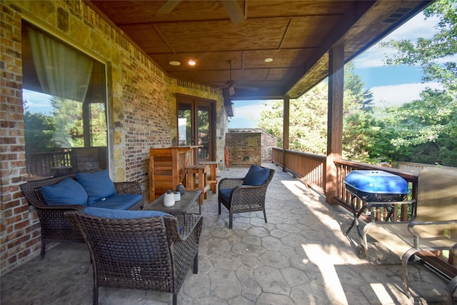 view of patio featuring an outdoor living space and ceiling fan