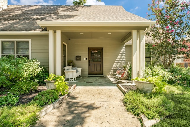 property entrance featuring a patio area