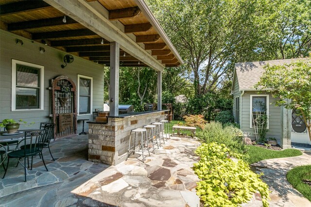 view of patio with a bar