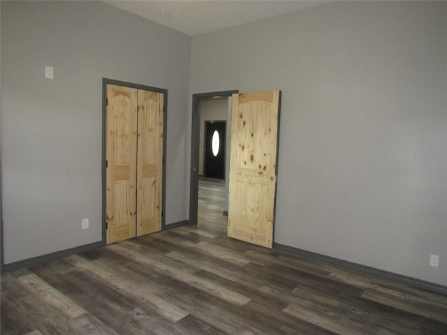 spare room featuring dark hardwood / wood-style floors