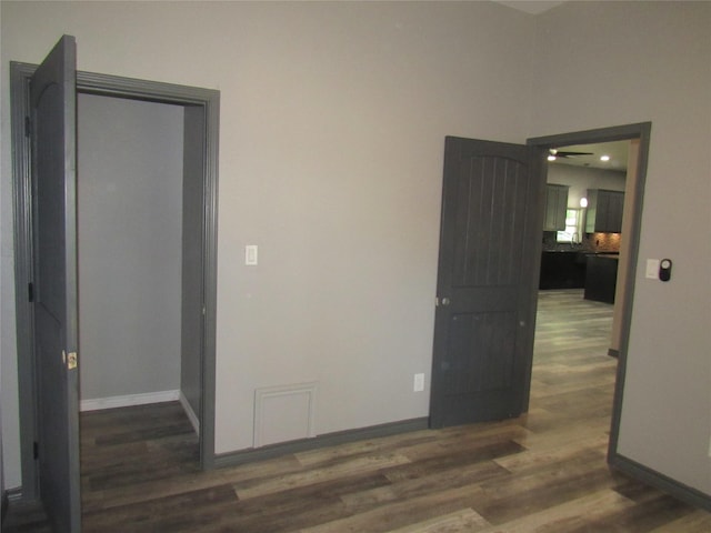 spare room featuring dark hardwood / wood-style flooring