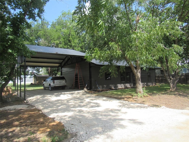 243 Pueblo St, Gordonville, TX 76245 - view of parking featuring gravel driveway and a carport
