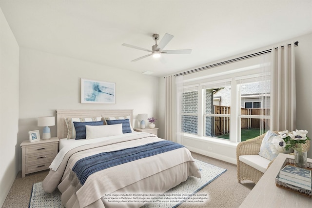 bedroom featuring ceiling fan and light colored carpet