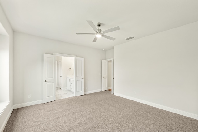 spare room featuring carpet floors and ceiling fan