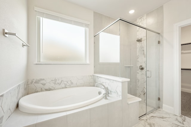 bathroom with separate shower and tub