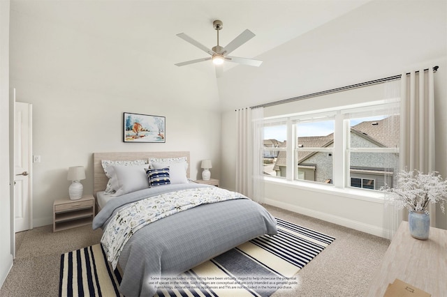 carpeted bedroom with vaulted ceiling and ceiling fan