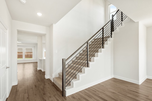 staircase featuring hardwood / wood-style floors