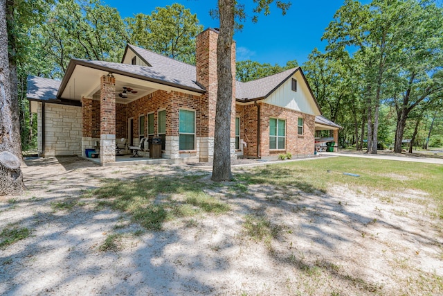 back of property featuring a patio area and ceiling fan