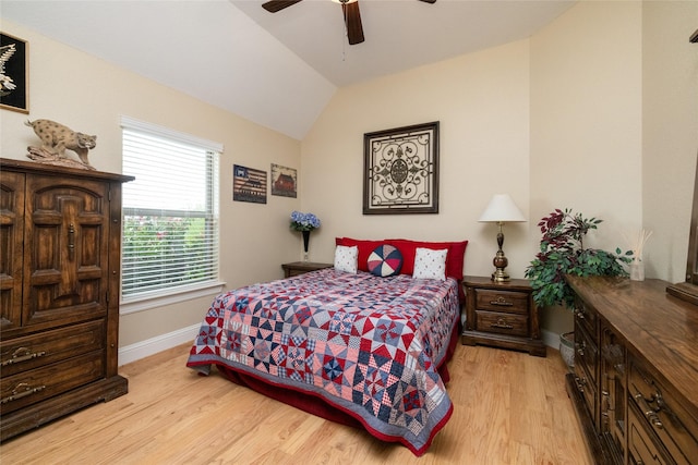 bedroom with lofted ceiling, ceiling fan, light wood-style flooring, and baseboards