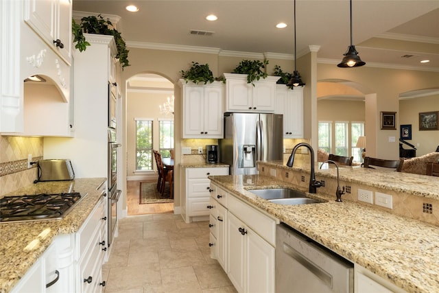 kitchen featuring visible vents, appliances with stainless steel finishes, white cabinets, and a sink