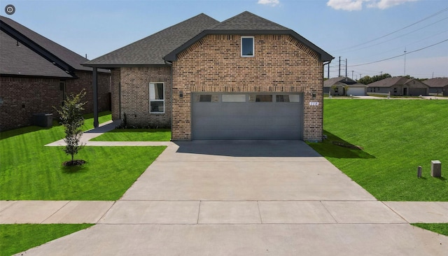 front facade with a front lawn and a garage