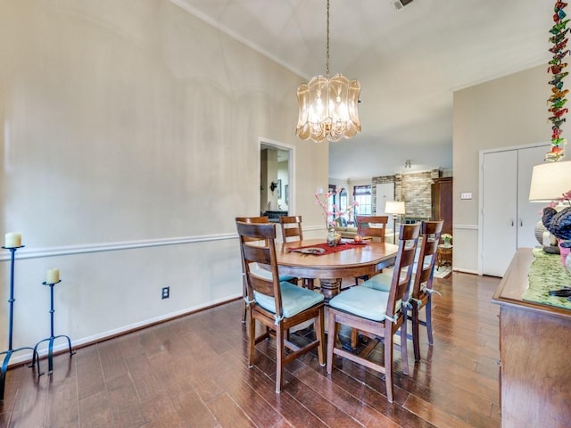 dining room featuring dark hardwood / wood-style flooring and a chandelier