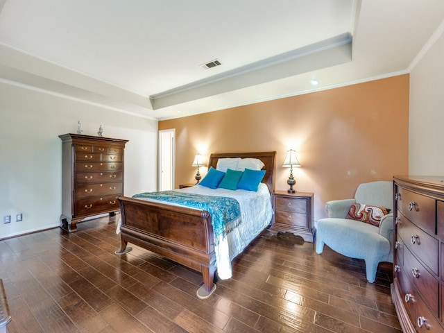 bedroom featuring a raised ceiling and ornamental molding