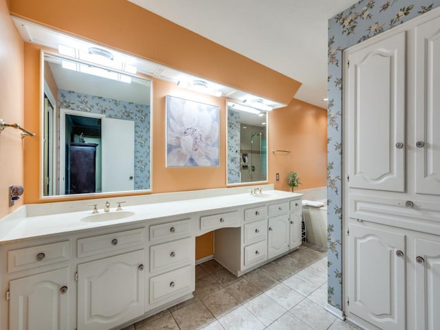 bathroom with tile patterned floors and vanity