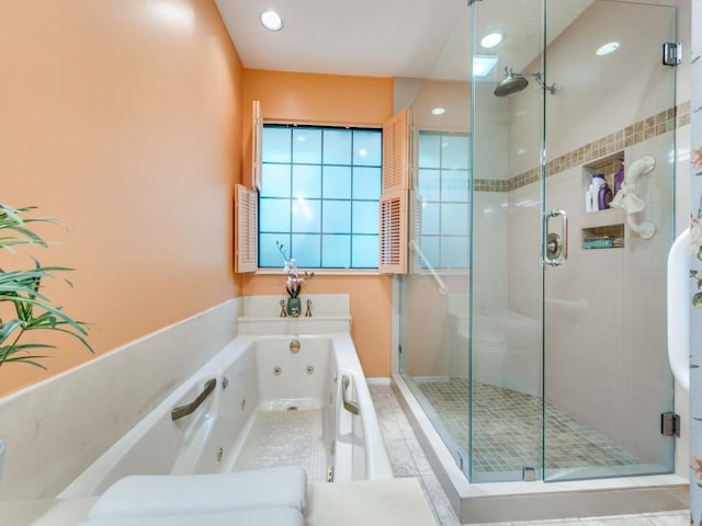 bathroom with separate shower and tub