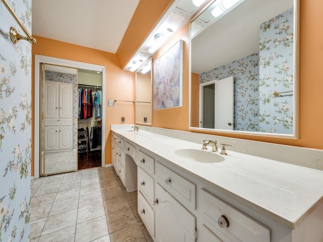 bathroom with tile patterned floors and vanity