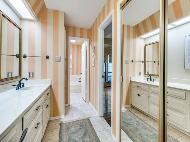 bathroom featuring tile patterned flooring and vanity