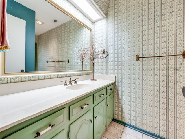 bathroom with vanity and tile patterned floors