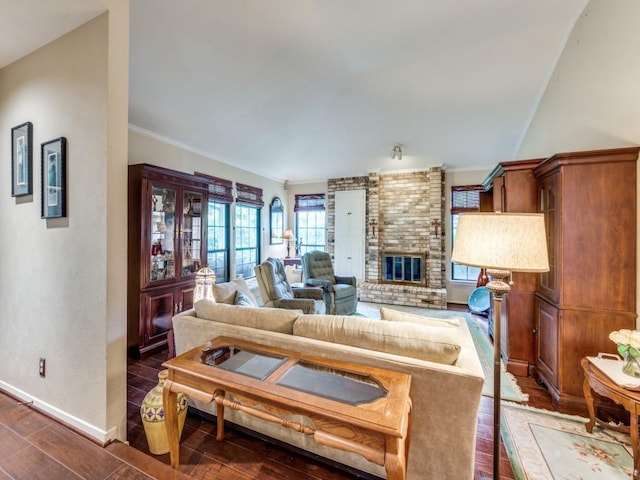 living room with a brick fireplace and dark hardwood / wood-style floors