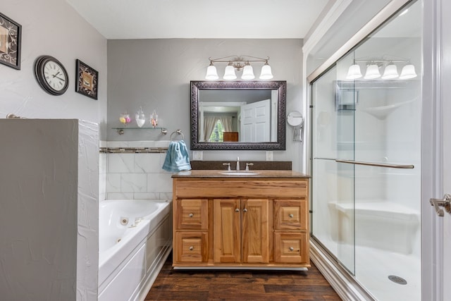 bathroom with vanity, hardwood / wood-style floors, and independent shower and bath